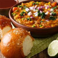 Bombay Pav Bhaji · Vegetable curry with signature spices topped with cheese and dry fruit served with pav (brea...