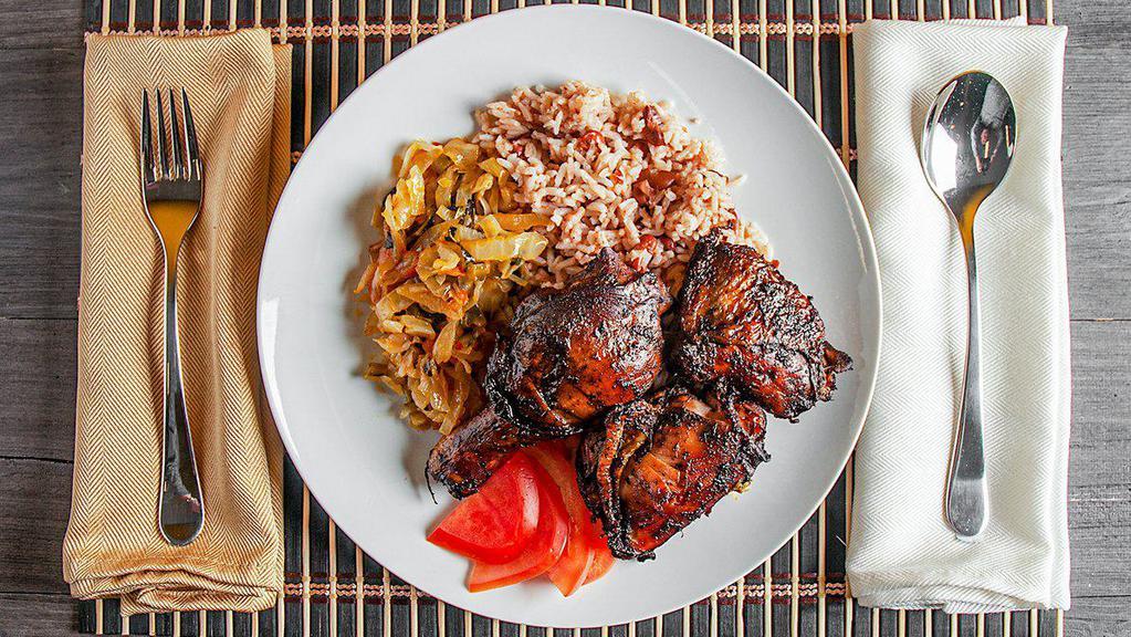 Jerk Chicken · Comes with white rice or rice and beans and one other side