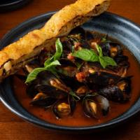 Mussels Fra Diavolo · Spicy calabrian chile, garlic, basil.