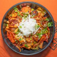 Spicy Squid Rice · Rice topped with stir-fried spicy squid and vegetables.