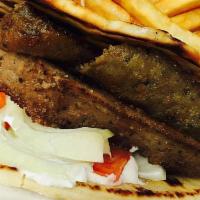 Gyro · Classic Greek sandwich. Served on pita bread with tomato, onion, and delicious cucumber sauc...