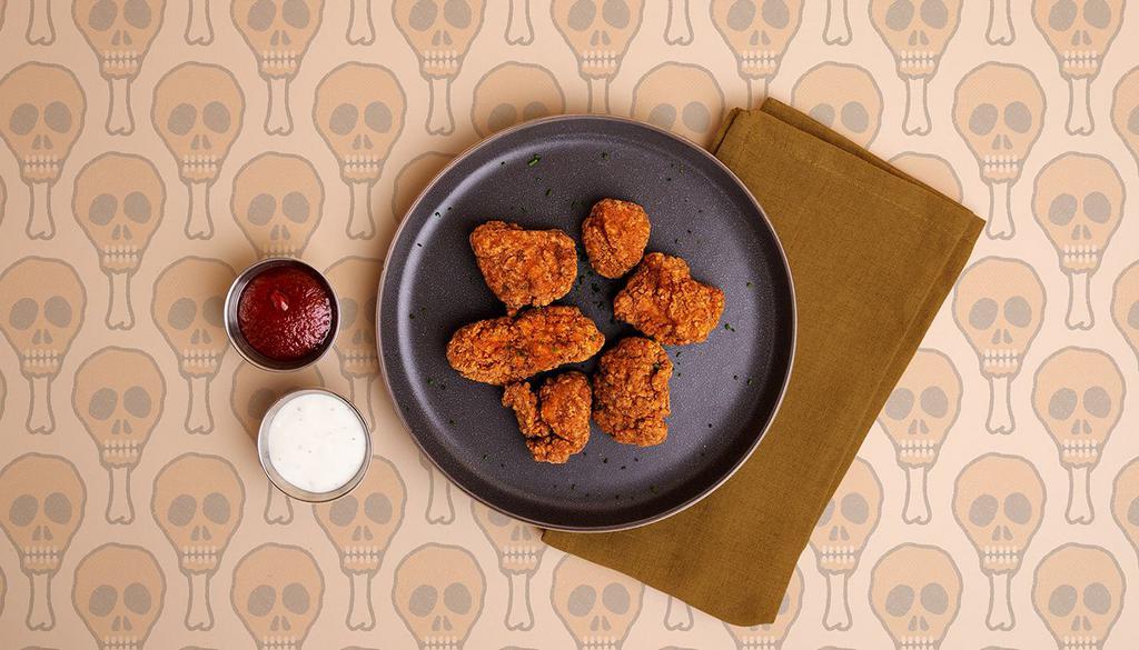 Popcorn Chicken · 12 bites of crispy breaded chicken with your choice of dipping sauce.