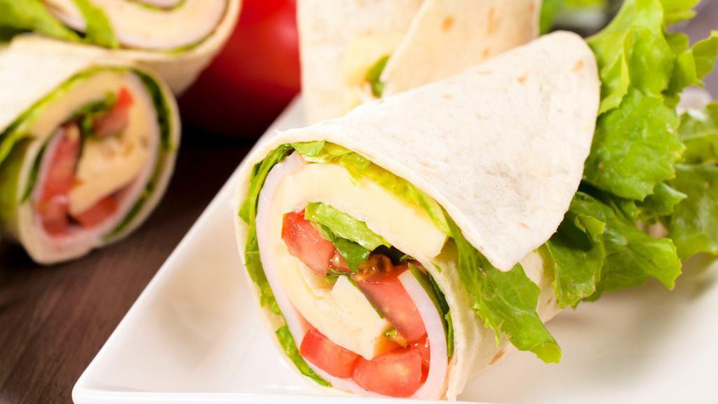 Chicken Caesar Wrap · Grilled chicken, romaine lettuce, parmesan cheese, and Caesar dressing folded into a wrap.