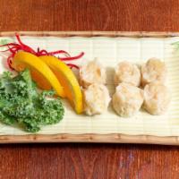 Shumai · Steamed shrimp dumplings with dipping sauce.