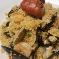 Seafood Fried Rice  · Lobster, shrimp, squid, black mussels, clams, onion, carrots, peas.