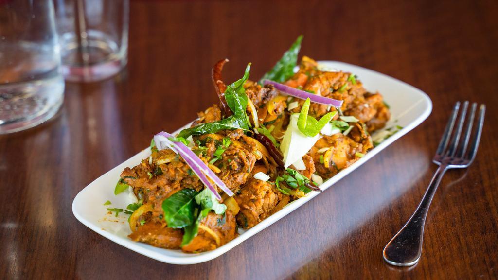 Chicken Sukka · Choice of meat marinated in medley of spices and cooked till dry. Garnished with curry leaves.
