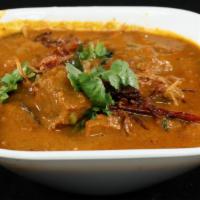 Goat Curry · Our special curry with south Indian style of cooking that's a tad spicy, tangy and tasty.