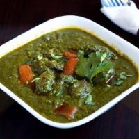 Goat Saag · Goat cooked in a leafy based sauce, saag (spinach) in this case with a touch of cream.