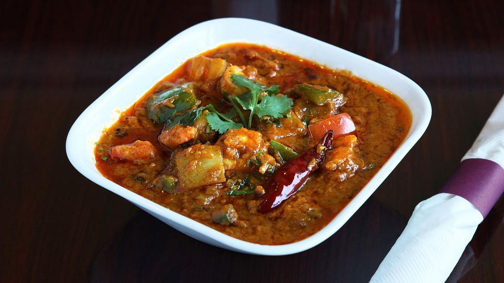 Kadai Shrimp · Shrimp cooked in a tomato and onion gravy base. This dish only requires one kadai (utensil) to get cooked.