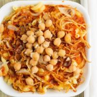 Koshary · Vegetarian. A hearty dish starring lentils, rice, pasta, and a rich spicy tomato sauce; topp...