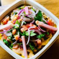 Fava Beans · Vegan. Gluten-free. Slow-cooked fava beans topped with olive oil, tahini sauce, lime and spi...