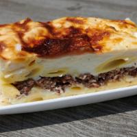 Macaroni Bechamel · Pasta baked with a house-made creamy bechamel sauce and stuffed with ground beef.