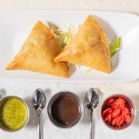 Vegetable Samosa · A crispy pastry stuffed with mildly spiced potatoes and peas. 2 pcs in an order