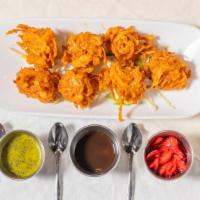 Vegetable Pakora · Fresh vegetables dipped in a delicately spiced batter and deep fried.