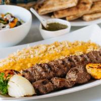 Sansom Kabob · Combination of lamb, beef and chicken marinated in spices and garlic on (2) skewers served w...