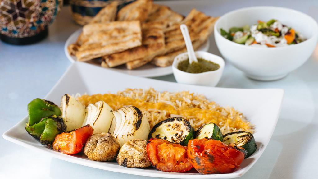 Vegetarian Kabob · Onions, peppers, squash and mushrooms cooked on (2) skewers served with afghan rice, afghan salad and afghan bread.