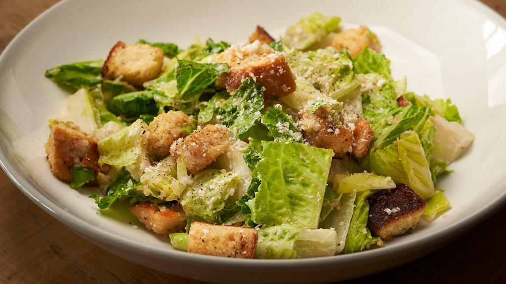 Caesar Salad · romaine lettuce, black pepper, croutons, pecorino romano, Caesar dressing.