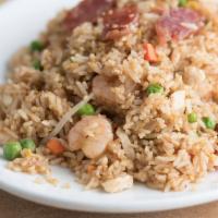Cơm Chiên Dương Châu · Yang chau fried rice. A combination of shrimp, chicken, eggs Chinese sausage and mixed veget...