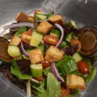 Garden Salad · Fresh spring mix with cherry tomatoes, red onions, cucumbers, and our homemade garlic crouto...