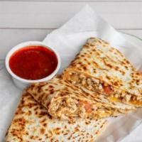 Chicken Quesadilla · Chopped chicken, cheddar cheese and diced tomatoes, fried onions, sour cream and salsa
