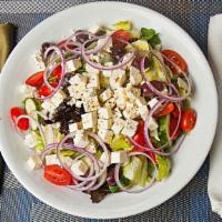 Greek Salad · Romaine and Iceberg, crumbled feta cheese, tomatoes, cucumbers, Kalamata olives and red onio...