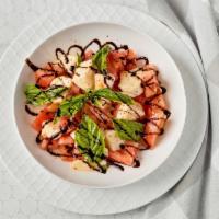 Tomato & Mozzarella Salad · Tomato, fresh mozzarella and basil, drizzled with a balsamic glaze.