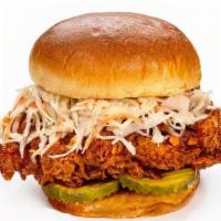 Nashville Hot Chicken Sandwich · Hand-breaded, no antibiotic ever chicken breast, Nashville hot infused oil, dill pickles, co...