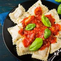 Ravioli · Freshly made ravioli pasta with ricotta, fresh herbs, basil, and our famous tomato sauce.
