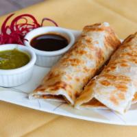 Chicken Kaathi Roll · Thin Indian homemade bread wrapped around charcoal grilled chicken tikka with sautéed onions...