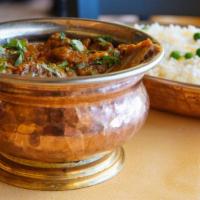 Baigan Bharta · Whole egg plant smoked over charcoal and seasoned with herbs and spices. Served with saffron...