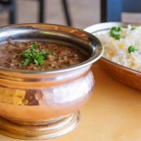 Dhaba Daal · Rich and buttery split black lentils-daily favorite. Served with saffron basmati rice and ma...