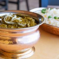 Murg Saag · Tender pieces of chicken breast spiced and cooked with fresh spinach. Served with saffron ba...