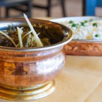 Saag Lamb · Tender lamb pieces cooked with lightly spiced fresh spinach. Served with saffron basmati ric...