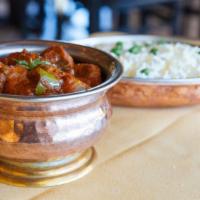 Kadai Gosht Masala · Lamb cubes sautéed with red onions, bell peppers, fresh tomatoes, and tempered with fenugree...