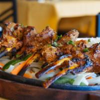 Tandoori Lamb Chops · French rack of lamb, marinated with sour scream and spices and grilled in the tandoor oven. ...