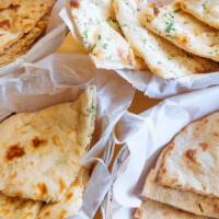 Garlic Naan · Leavened bread with garlic and cilantro.