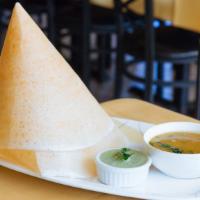 Plain Dosa · Made from rice and lentil batter. served with spicy lentil broth and coconut chutney.