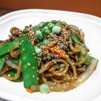 Noodle Stir Fry · Our handmade noodles sauteed with Onions, Carrots, Mushrooms and Snap Peas. (Vegan)
