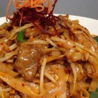 Pad Thai · Spicy. Thin flat noodles, tofu and bean sprouts topped with crushed peanut and lime.