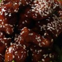 Sesame Chicken · Fried chicken sauteed with sesame seeds in brown sweet and tangy sauce and American broccoli...