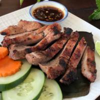 Moo Yang (Bbq Pork) · Grilled pork served with spicy tangy tamarind sauce.