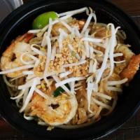 Pad Thai · Stir-fried thin rice noodles with egg, scallions, sweet radish, bean sprouts, and ground pea...