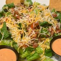 Fiesta Salad · romaine, pico de gallo, black beans, sweet corn, shredded jack cheese  & bacon served with s...