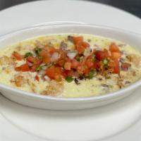 Machados Dip · steak, Grilled Chicken and Shrimp covered with Pico de gallo and Cheese dip