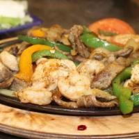Fajita Texana · Combination of chicken, beef, and shrimp. Cooked with onion, red and green bell peppers, and...