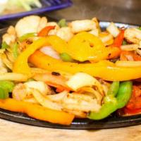 Fajita Camaron · Shrimp fajitas. Cooked with onion, red and green bell peppers, and tomatoes. Served with ric...