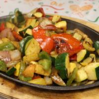 Vegetarian Fajita · A combination of vegetables, tomatoes, onions, bell peppers, mushrooms, zucchini seasoned & ...