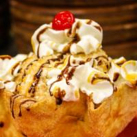 Mexican Fried Ice Cream · Vanilla ice cream covered with rice krispies. Served with whipped cream, caramel, cinnamon, ...