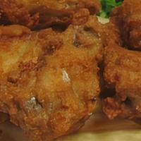 Chicken Wings · Cooked wings of a chicken coated in sauce or seasoning.