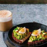Avocado Toast · Creamy avocado topped with a hardboiled egg on toasted sesame multigrain bread.